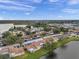Aerial view of community near lake and convenient to local amenities at 3840 Staysail Ln # 3840, Holiday, FL 34691