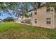 Condo building exterior and backyard at 3840 Staysail Ln # 3840, Holiday, FL 34691