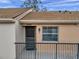 Cozy condominium with balcony, dark door, and neutral exterior at 3840 Staysail Ln # 3840, Holiday, FL 34691