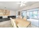 Living room features gray sectional sofa and access to enclosed patio at 3840 Staysail Ln # 3840, Holiday, FL 34691