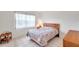 Guest bedroom with full-size bed and window at 3840 Staysail Ln # 3840, Holiday, FL 34691