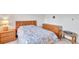 Cozy bedroom with a double bed, dresser, and nightstand at 3840 Staysail Ln # 3840, Holiday, FL 34691