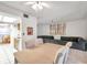 Spacious dining area with table, chairs, and a gray sectional sofa at 3840 Staysail Ln # 3840, Holiday, FL 34691