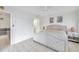 Main bedroom with king-size bed and access to the sunroom at 3840 Staysail Ln # 3840, Holiday, FL 34691