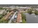 Aerial view of community featuring lakefront access, pool, and parking at 3840 Staysail Ln # 3840, Holiday, FL 34691