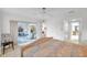 Bedroom with king-size bed and sunroom access at 3840 Staysail Ln # 3840, Holiday, FL 34691