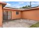 A view of the backyard patio with sliding glass doors and a solar panel installation on the roof at 460 48Th S St, St Petersburg, FL 33711