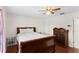 Comfortable bedroom featuring wood floors, ceiling fan, and a large window at 460 48Th S St, St Petersburg, FL 33711