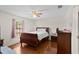 Cozy bedroom with wood floors, ceiling fan, window and closet at 460 48Th S St, St Petersburg, FL 33711