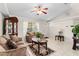 Inviting living room boasts tile floors, neutral tones, ceiling fan, and natural light at 460 48Th S St, St Petersburg, FL 33711