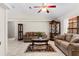 Traditional living room featuring neutral tones, tile flooring, ceiling fan and two sofas at 460 48Th S St, St Petersburg, FL 33711