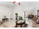 Spacious living room featuring tile floors, neutral tones, ceiling fan and view to dining area at 460 48Th S St, St Petersburg, FL 33711