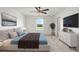 Spacious main bedroom with a large bed, dresser, and a view of the backyard at 5315 Companion Ln, Tampa, FL 33619