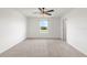 Bright bedroom with carpeted floor and a ceiling fan, offering ample space at 5315 Companion Ln, Tampa, FL 33619