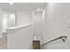 Bright, open staircase with a simple handrail leading to the lower level at 5315 Companion Ln, Tampa, FL 33619