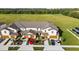 Aerial view of townhouses with garages and landscaping at 5315 Companion Ln, Tampa, FL 33619