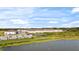 Aerial view of townhome community by a lake at 5315 Companion Ln, Tampa, FL 33619