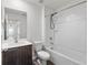 Clean bathroom with a bathtub, toilet, vanity, and dark brown cabinets at 5315 Companion Ln, Tampa, FL 33619