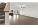Open living room with hardwood floors and access to kitchen at 5315 Companion Ln, Tampa, FL 33619