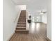 Staircase with carpeted steps and wood handrail at 5315 Companion Ln, Tampa, FL 33619
