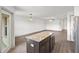 Kitchen island with granite countertop and dark cabinets at 5315 Companion Ln, Tampa, FL 33619