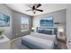 Serene bedroom with gray walls, a ceiling fan, and a comfy bed at 5315 Companion Ln, Tampa, FL 33619