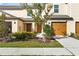 Tan two-story home with landscaping and garage at 5315 Companion Ln, Tampa, FL 33619