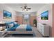 Bright bedroom with pink walls, a ceiling fan, and a comfortable-looking bed at 5315 Companion Ln, Tampa, FL 33619