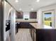 Modern kitchen with stainless steel appliances and island at 5315 Companion Ln, Tampa, FL 33619