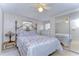 Bedroom with a floral comforter and mirrored closet doors at 5330 Vera St, Zephyrhills, FL 33542