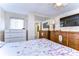 Bedroom with two dressers and a large TV at 5330 Vera St, Zephyrhills, FL 33542