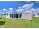 Property boasts a spacious backyard with shed and well-maintained lawn at 5330 Vera St, Zephyrhills, FL 33542