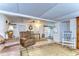 Living room with leather recliner and rocking chair, open to dining area at 5330 Vera St, Zephyrhills, FL 33542