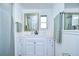 Clean bathroom with white vanity and shower at 5330 Vera St, Zephyrhills, FL 33542