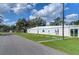 White community building with golf-themed mural at 5330 Vera St, Zephyrhills, FL 33542