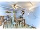 A dining area with a wood table and white chairs at 5330 Vera St, Zephyrhills, FL 33542