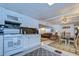 White kitchen with granite countertops and stainless steel appliances at 5330 Vera St, Zephyrhills, FL 33542