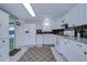 White kitchen with granite countertops and stainless steel appliances at 5330 Vera St, Zephyrhills, FL 33542