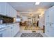 White kitchen cabinets, granite countertops, and modern appliances at 5330 Vera St, Zephyrhills, FL 33542
