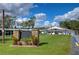 Community clubhouse with landscaping and signage at 5330 Vera St, Zephyrhills, FL 33542