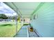 Covered walkway with planter and bench, leading to the front entrance at 5330 Vera St, Zephyrhills, FL 33542