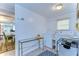 Bright laundry room with washer, dryer, and folding table at 5330 Vera St, Zephyrhills, FL 33542