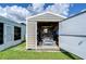 Open storage shed with golf cart and ample storage space at 5330 Vera St, Zephyrhills, FL 33542