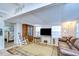 Living room, view to bedroom, features leather sofas and rocking chair at 5330 Vera St, Zephyrhills, FL 33542