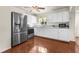 Modern kitchen with stainless steel appliances and white cabinets at 7695 17Th N Way, St Petersburg, FL 33702