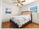 Bright bedroom with double bed and ceiling fan at 7695 17Th N Way, St Petersburg, FL 33702