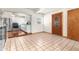 Open dining area with kitchen access and tile floors at 7695 17Th N Way, St Petersburg, FL 33702