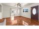 Bright living room featuring tile floors and a view into the kitchen at 7695 17Th N Way, St Petersburg, FL 33702