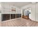 Dining area with built-in shelving and kitchen view at 7695 17Th N Way, St Petersburg, FL 33702