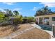 Large backyard with gravel, a patio, and landscaping at 7695 17Th N Way, St Petersburg, FL 33702
